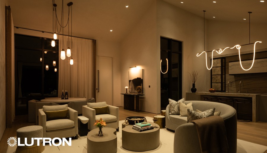Luxury living room with Lutron lighting control, featuring layered warm light, modern fixtures, and cozy seating.